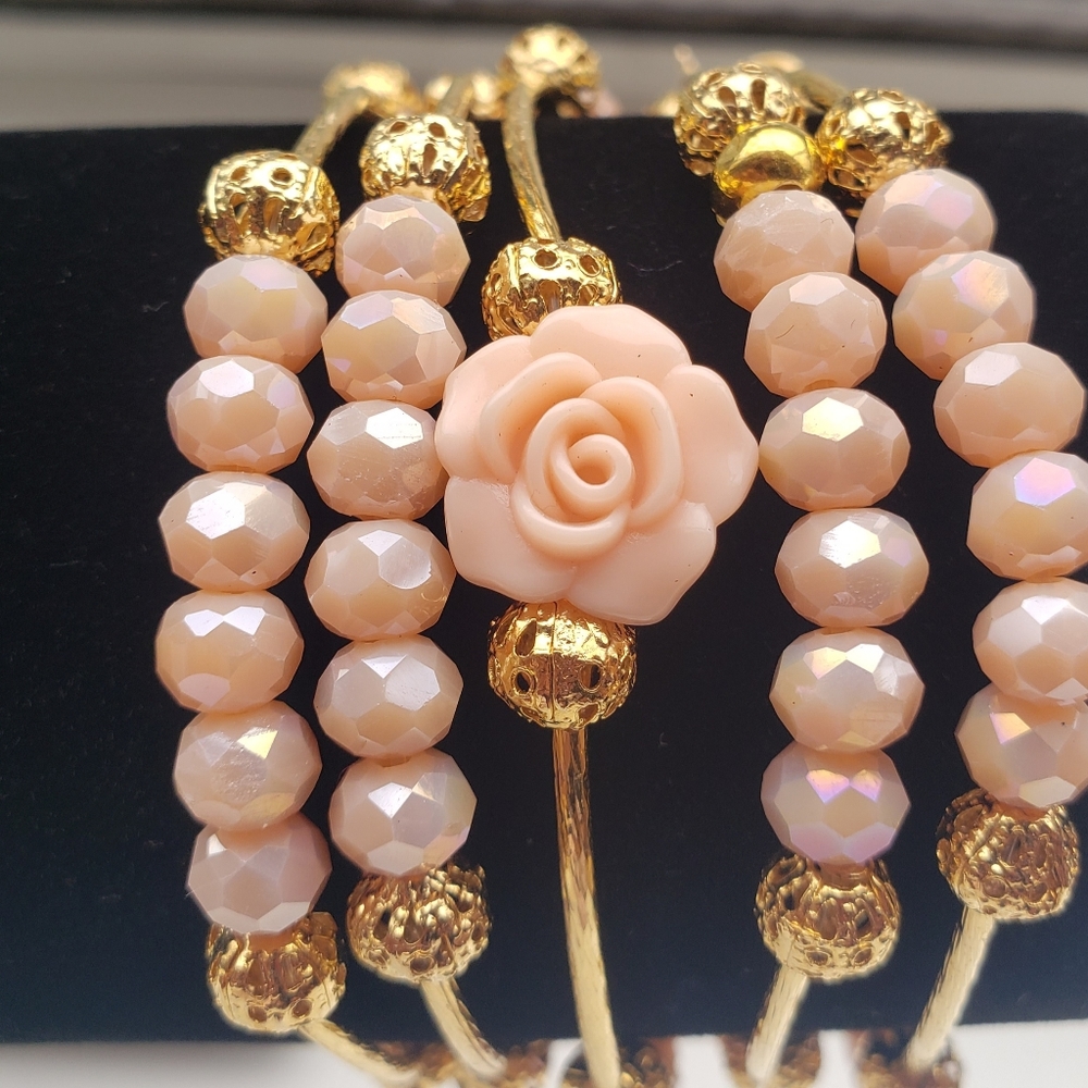 Set of 5 bracelets with gold-plated spacers.